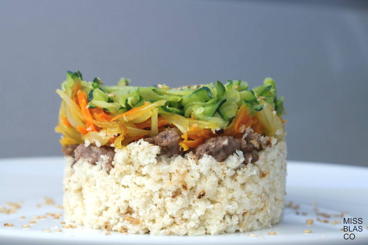 cauliflower rice with vegetables in a white plate