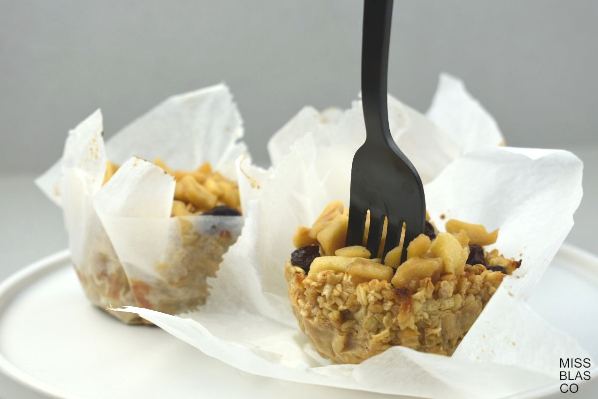 Vegan Sugar-Free Apple Oat Muffins with a fork
