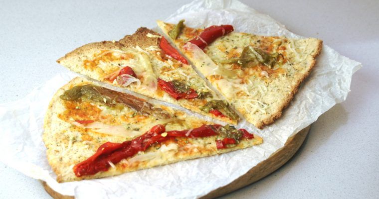 cawliflower pizza on a board